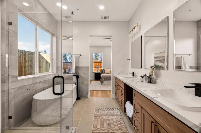 a white bath tub sitting next to a window