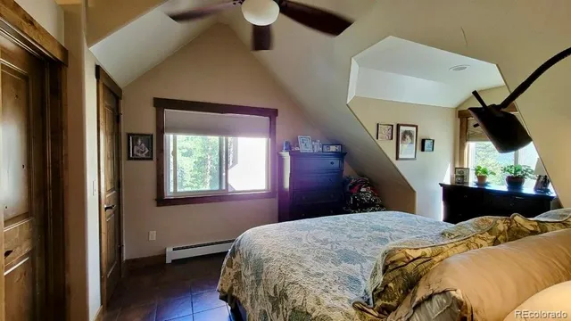 a view of a livingroom with furniture and a flat screen tv