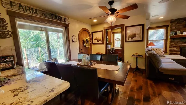 a kitchen with stainless steel appliances granite countertop a refrigerator and a stove