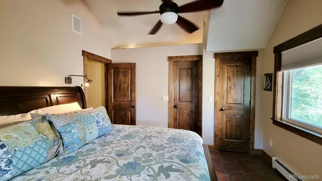 a wooden bench sitting in front of a building