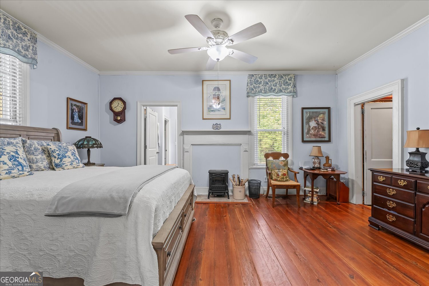 6644 East Cadley Road Norwood, GA 30821 - Photo 8 of 53 a bedroom with a bed and wooden floor