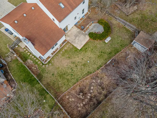 a view of a park with bench and trees