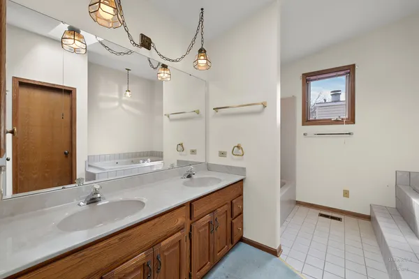 a bathroom with a sink a vanity and a mirror