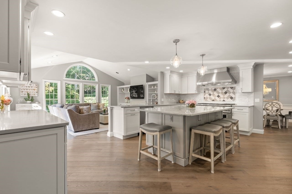 24 Queens Circle Sharon, MA 02067 - Photo 12 of 41 a kitchen with a table and chairs in it