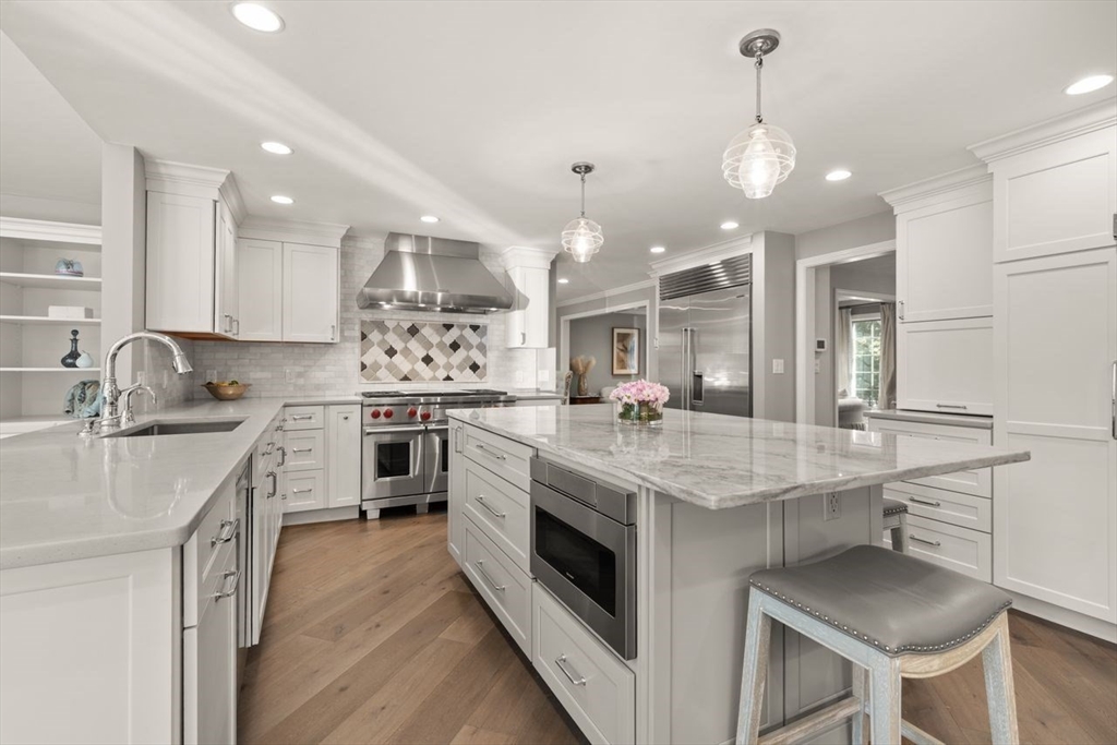 24 Queens Circle Sharon, MA 02067 - Photo 13 of 41 a kitchen with a sink stainless steel appliances and cabinets