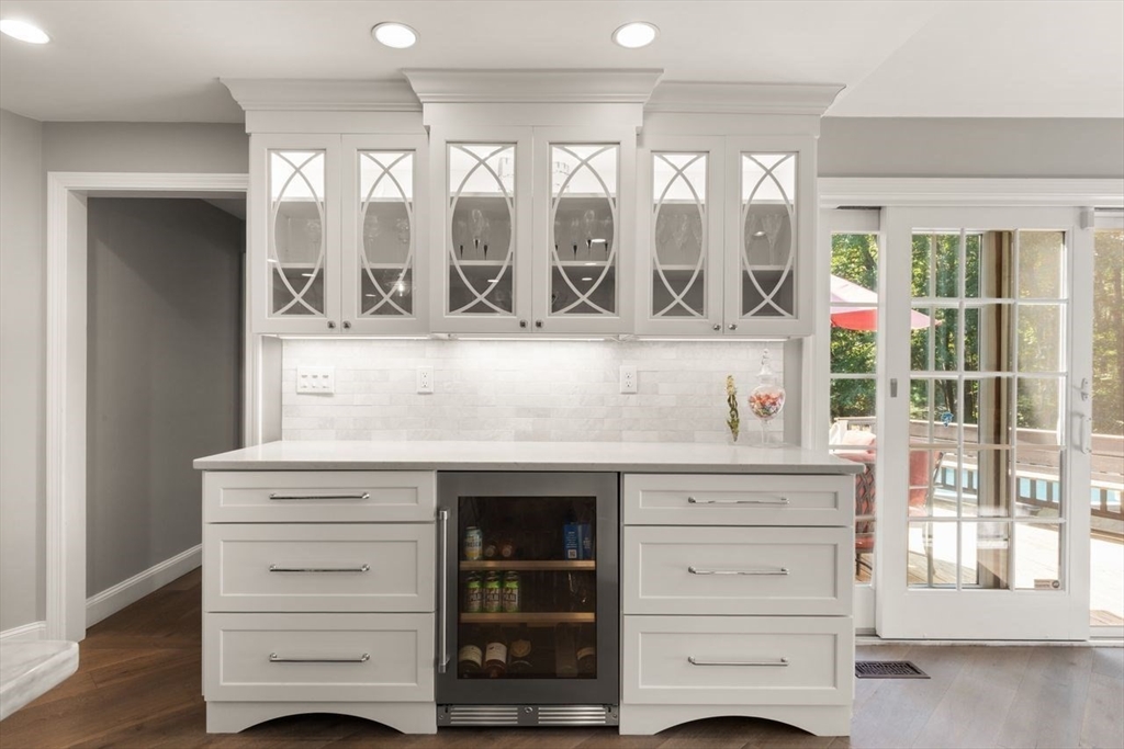24 Queens Circle Sharon, MA 02067 - Photo 16 of 41 a living room with furniture cabinets and a large window
