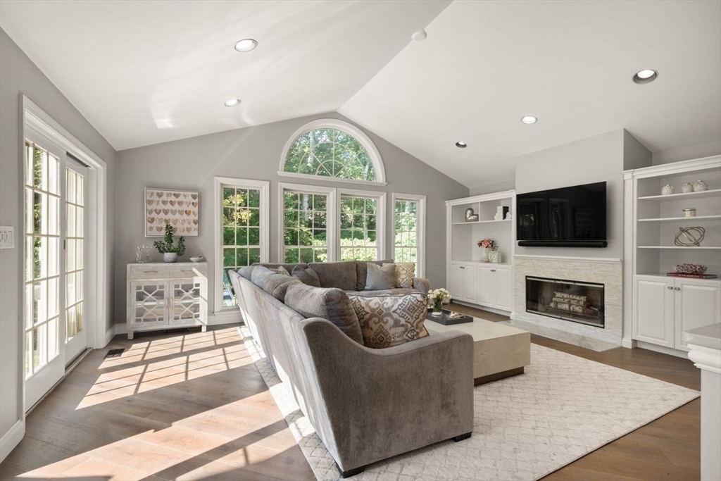 24 Queens Circle Sharon, MA 02067 - Photo 17 of 41 a living room with furniture large windows and flat screen tv