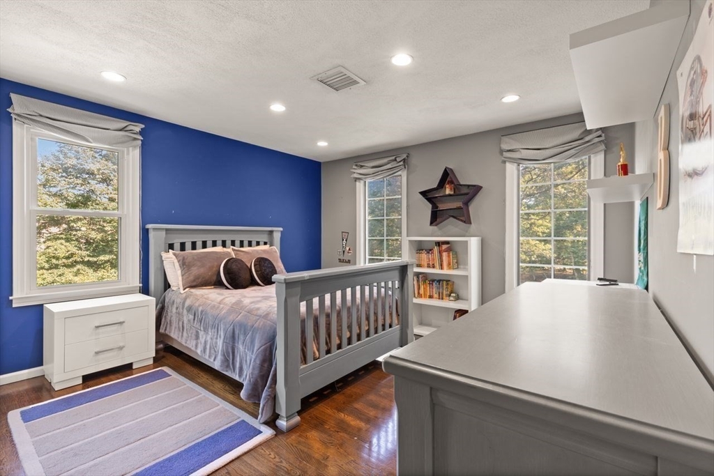 24 Queens Circle Sharon, MA 02067 - Photo 30 of 41 a bedroom with furniture and a window