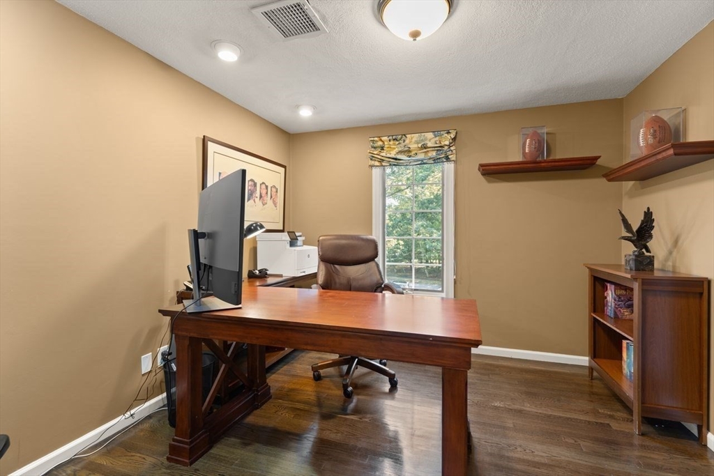 24 Queens Circle Sharon, MA 02067 - Photo 31 of 41 a view of a workspace with furniture and wooden floor