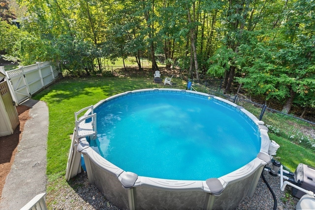 24 Queens Circle Sharon, MA 02067 - Photo 37 of 41 a view of a swimming pool with a garden
