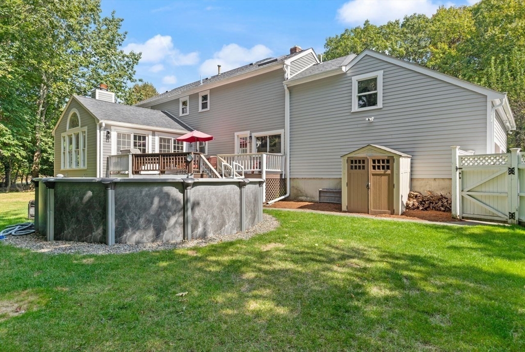 24 Queens Circle Sharon, MA 02067 - Photo 39 of 41 a view of a house with a yard and sitting area