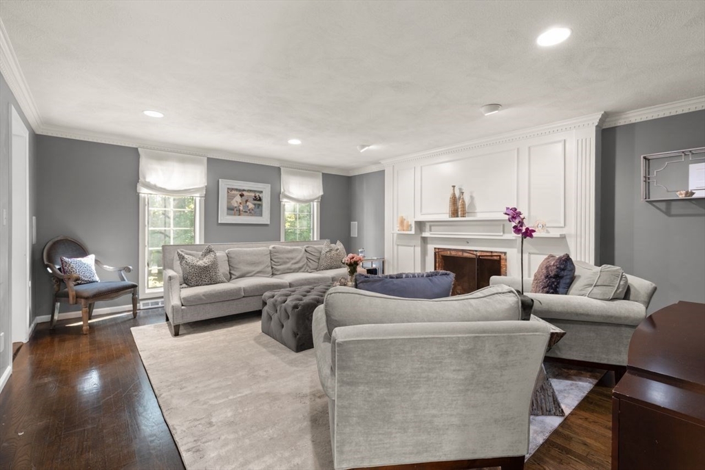 24 Queens Circle Sharon, MA 02067 - Photo 6 of 41 a living room with furniture a fireplace and a window