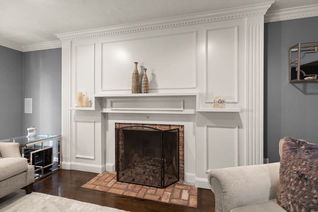 24 Queens Circle Sharon, MA 02067 - Photo 7 of 41 a living room with furniture and a fireplace
