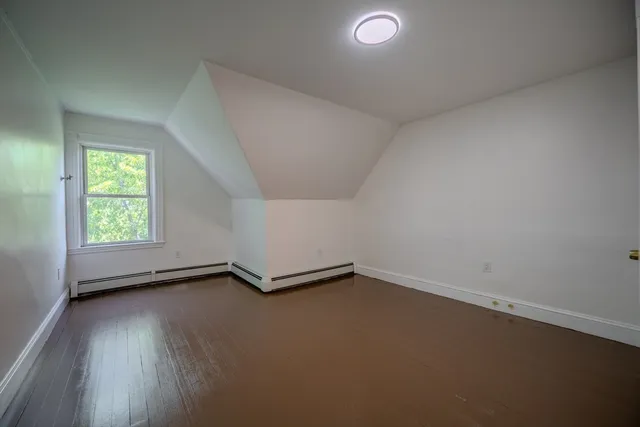 an empty room with a empty space and a window