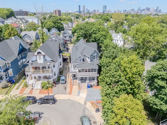 an aerial view of a house with a garden