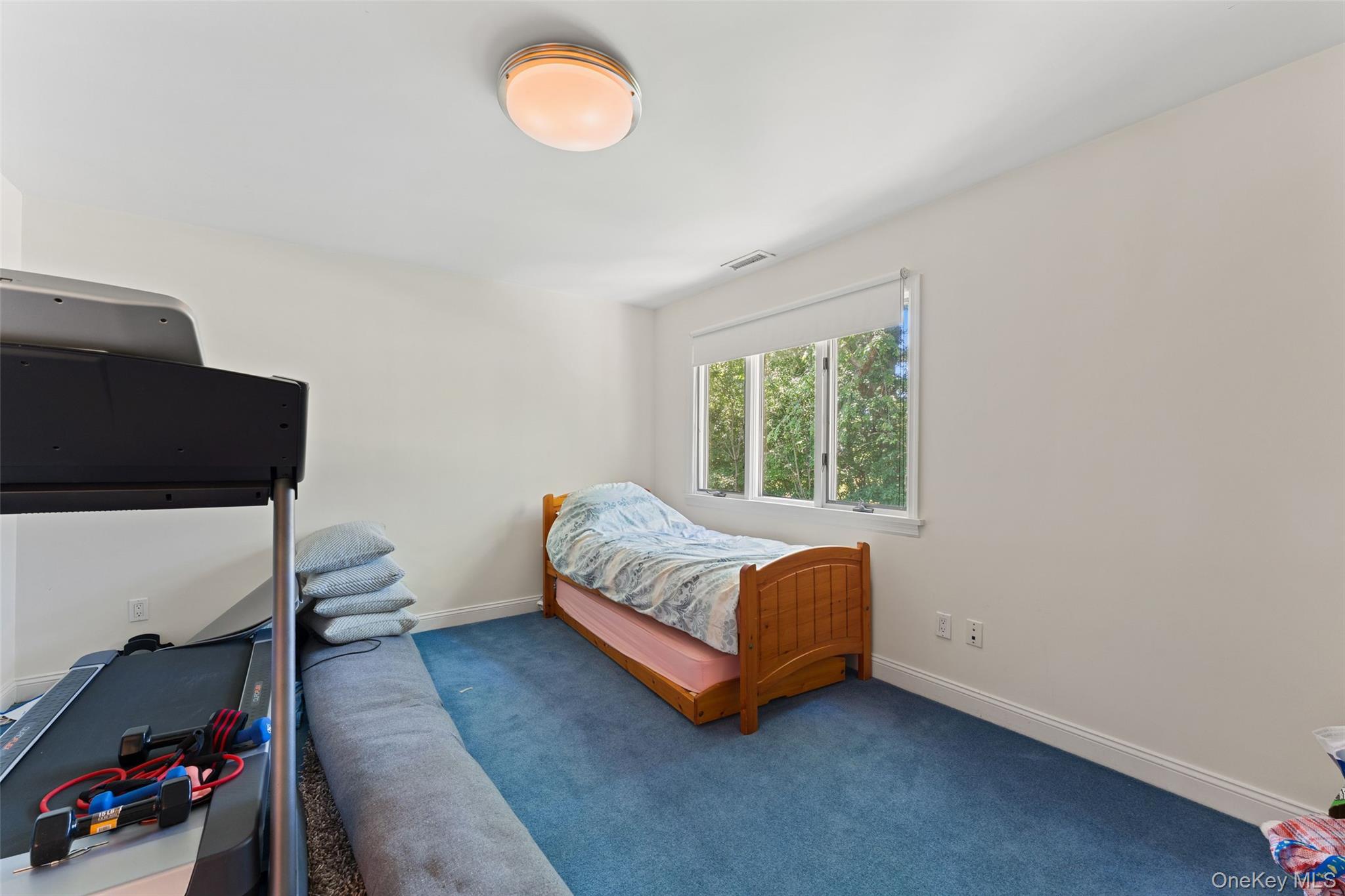 6 Magnetti Circle Mamaroneck, NY 10543 - Photo 14 of 24 a room with a bed and a chair