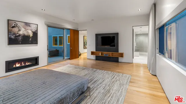 a spacious bathroom with a double vanity sink and a mirror