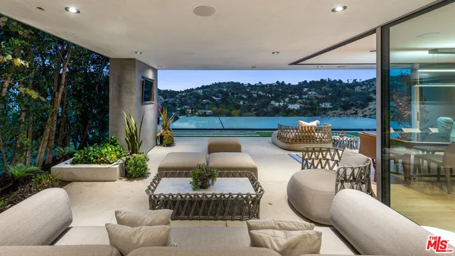 a outdoor living space with furniture and a potted plant