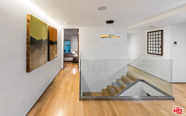 a room with furniture pool table and flat screen tv