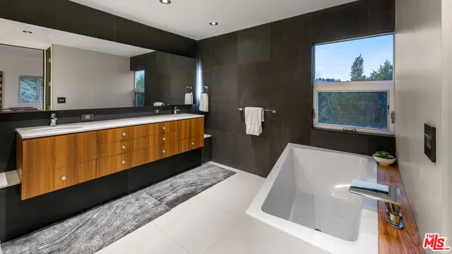 a living room with furniture and large window