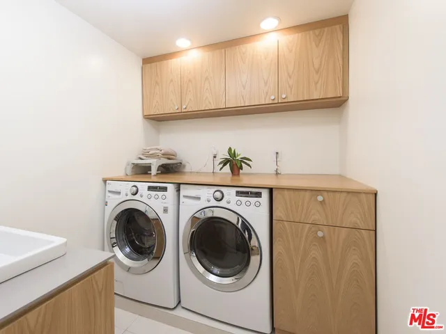 a front view of a house with a yard and a garage