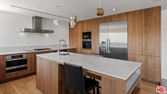 a dining room with furniture and a floor to ceiling window