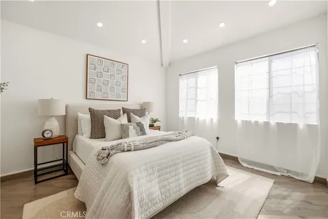 a bed room with a bed and a window