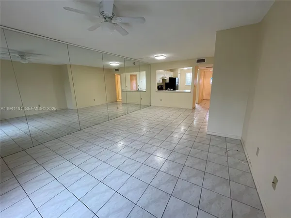 a view of a livingroom with a furniture and an entryway