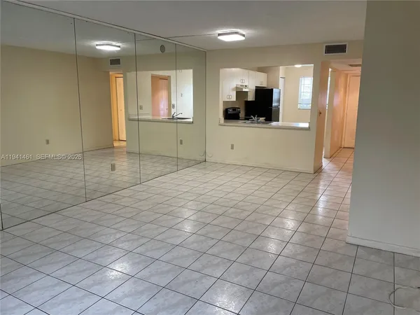 a view of a kitchen with a sink and a microwave