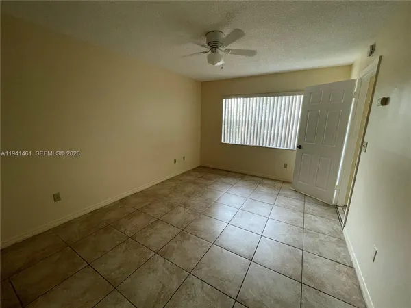 a view of an empty room and window