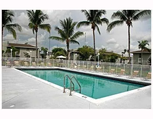 a view of swimming pool with outdoor seating