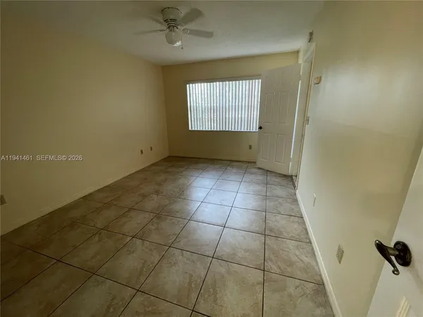 a view of an empty room and window