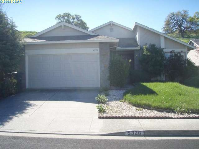 5326 Paso Del Rio Way Concord, CA 94521 - Photo 1 of 1 a front view of a house with a yard and garage