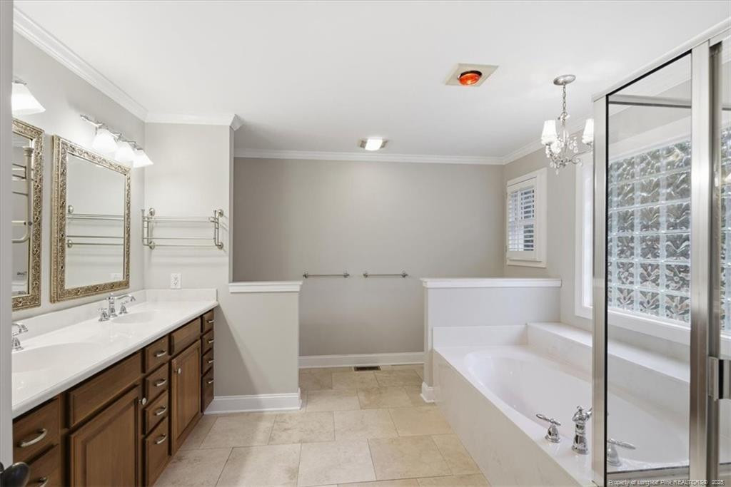 575 South Valley Road Southern Pines, NC 28387 - Photo 21 of 48 a bathroom with a tub sink and mirror