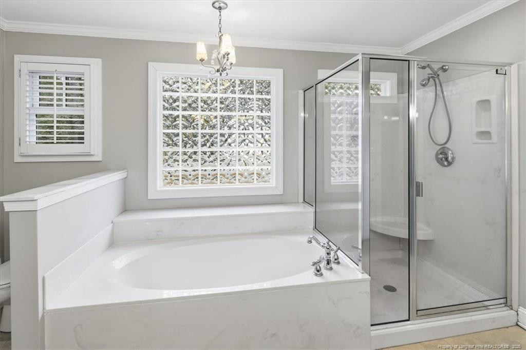 575 South Valley Road Southern Pines, NC 28387 - Photo 23 of 48 a bathroom with a bathtub and a shower