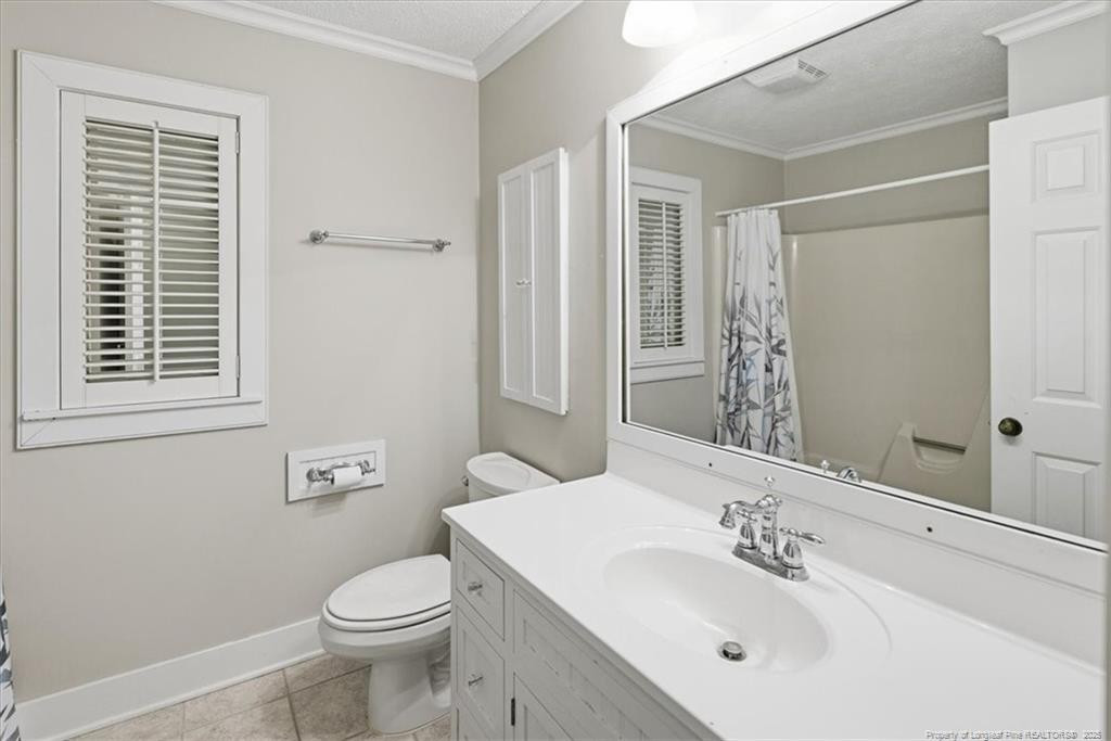 575 South Valley Road Southern Pines, NC 28387 - Photo 29 of 48 a bathroom with a sink toilet and mirror