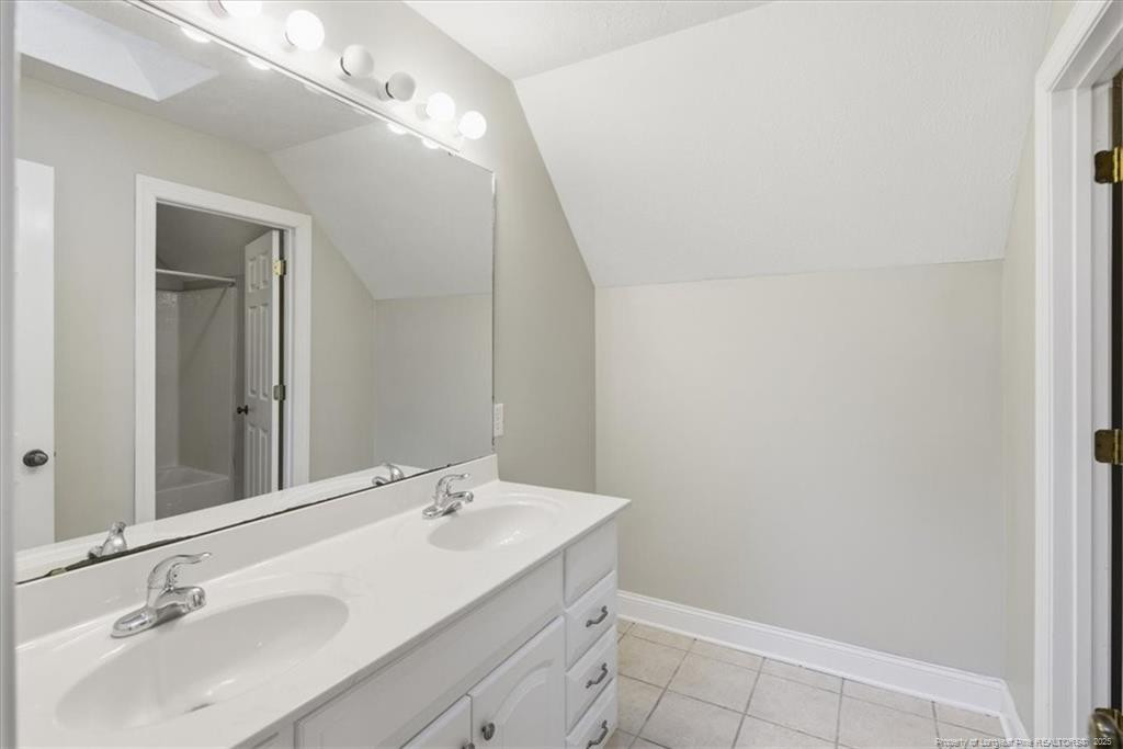575 South Valley Road Southern Pines, NC 28387 - Photo 35 of 48 a bathroom with a sink and a mirror