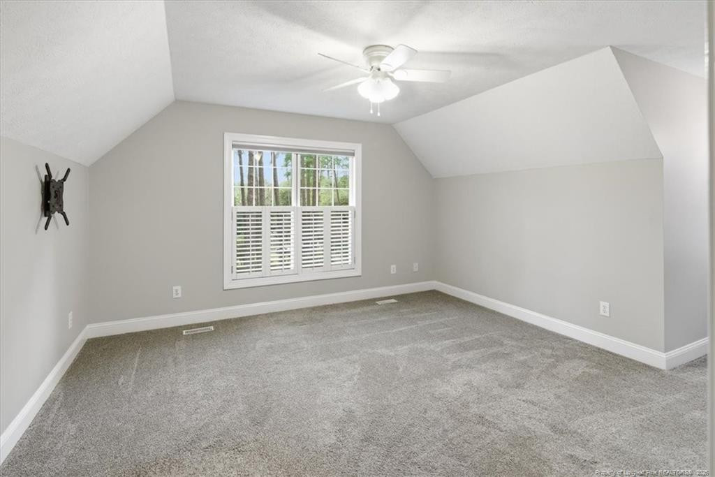 575 South Valley Road Southern Pines, NC 28387 - Photo 37 of 48 an empty room with a window and a fan