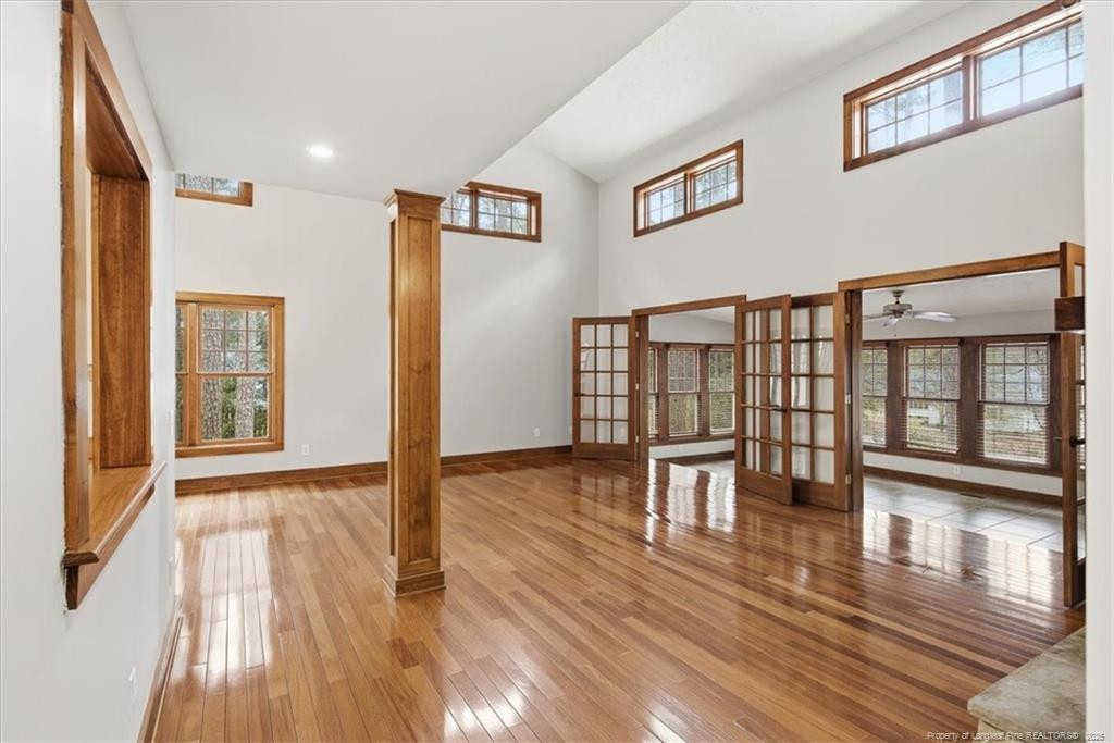 575 South Valley Road Southern Pines, NC 28387 - Photo 4 of 48 a view of a hallway with wooden floor and a living room