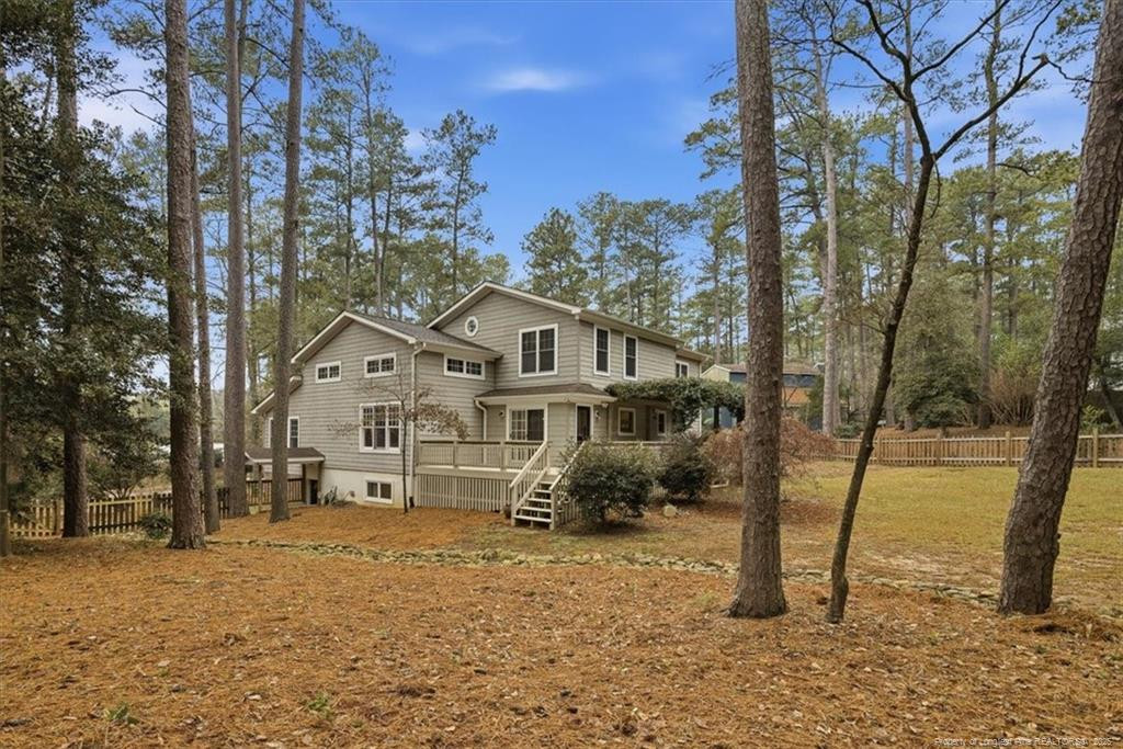 575 South Valley Road Southern Pines, NC 28387 - Photo 43 of 48 a view of a large white house with a yard covered with snow in the outdoor space