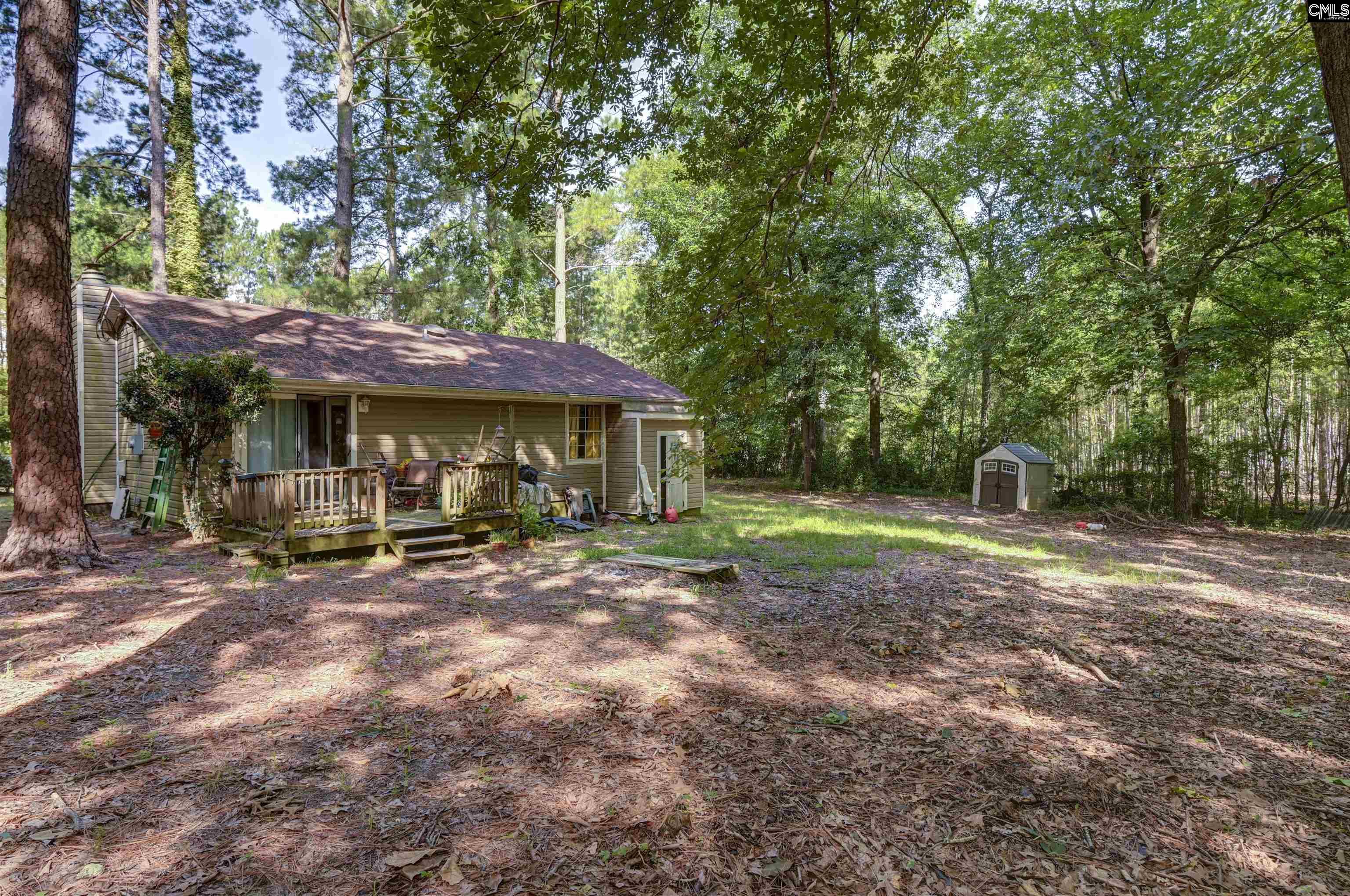 133 Sunset Strip Elgin, SC 29045 - Photo 29 of 30 a view of a house with backyard and sitting area