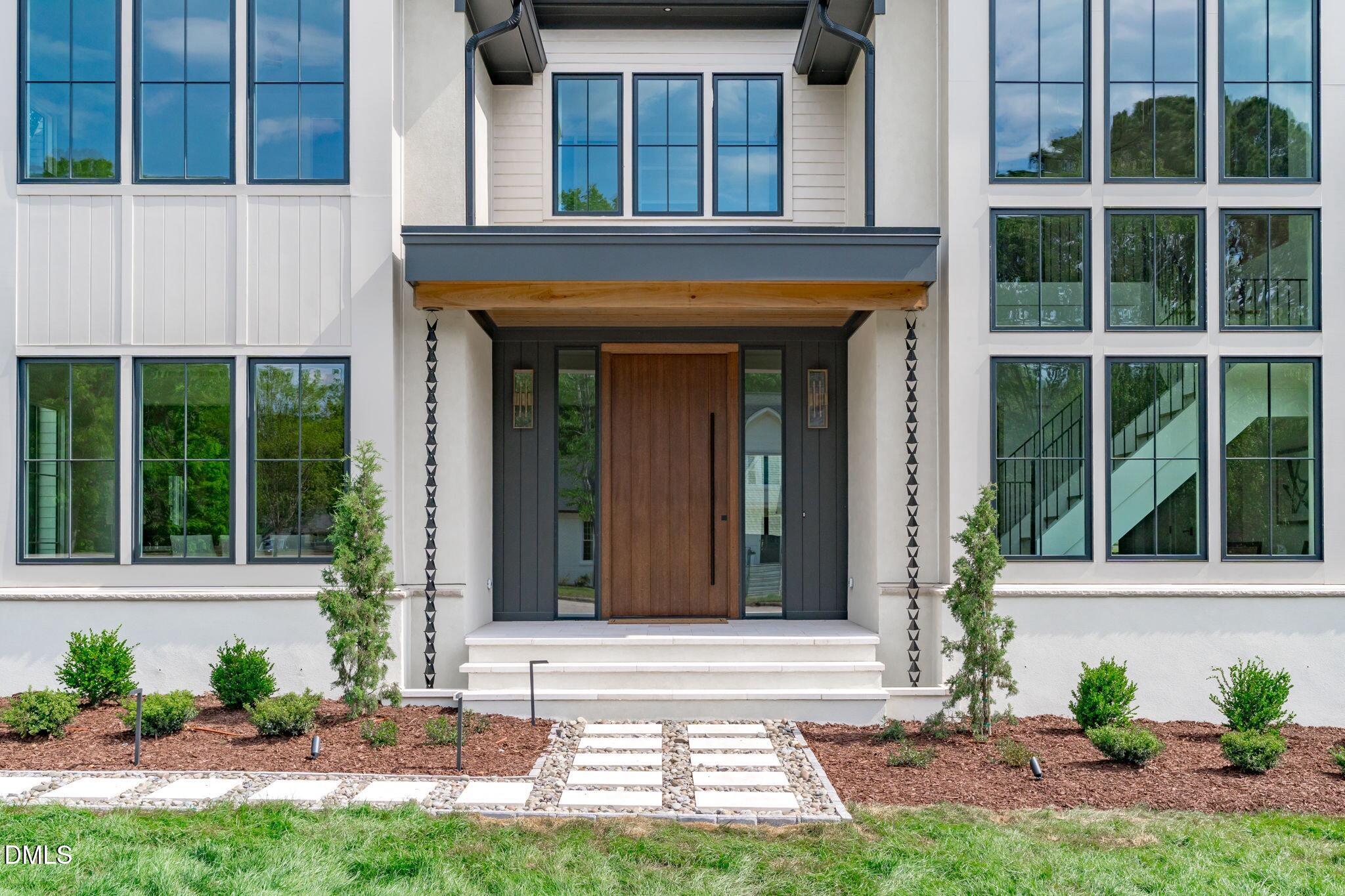 7917 South Bridgewater Court Raleigh, NC 27615 - Photo 5 of 67 a view of entrance of the house with a yard