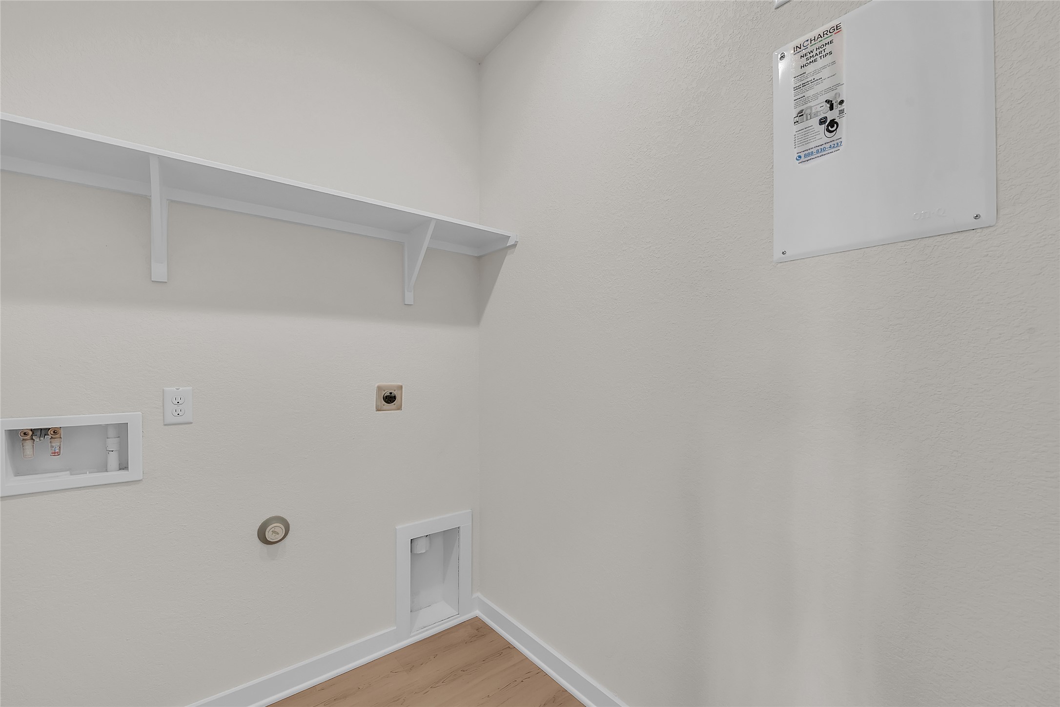 308 Boatright Boulevard Jarrell, TX 76537 - Photo 25 of 31 Laundry room with hookup for a gas dryer, light wood finished floors, hookup for a washing machine, and hookup for an electric dryer