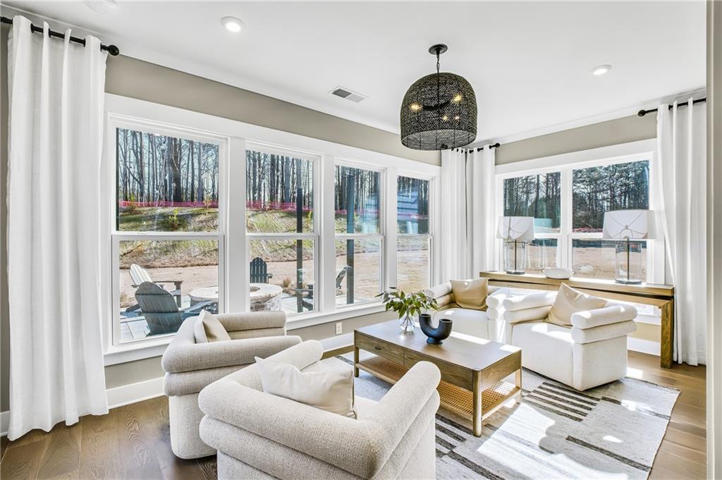 251 Rockledge Bend Powder Springs, GA 30127 - Photo 7 of 23 a living room with furniture and floor to ceiling windows