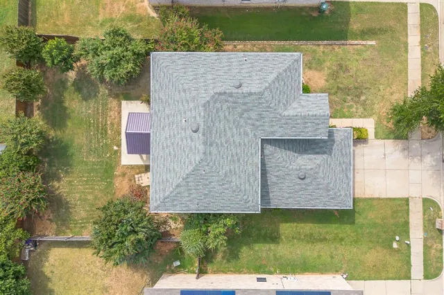 an aerial view of a house with a garden