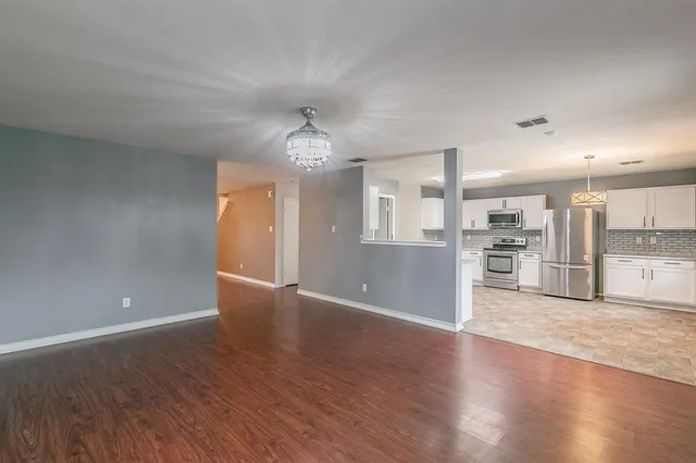 a view of kitchen with wooden floor