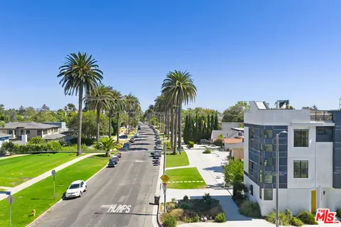 a view of swimming pool with outdoor seating and city view