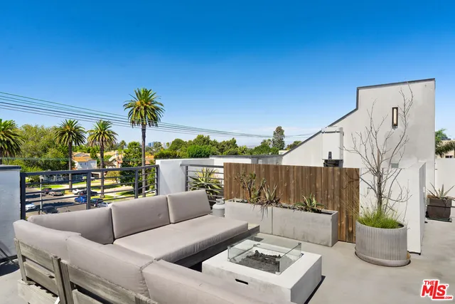 a view of a terrace with furniture