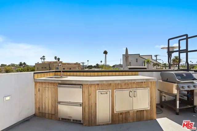 a bathroom with a double vanity sink toilet and a tub