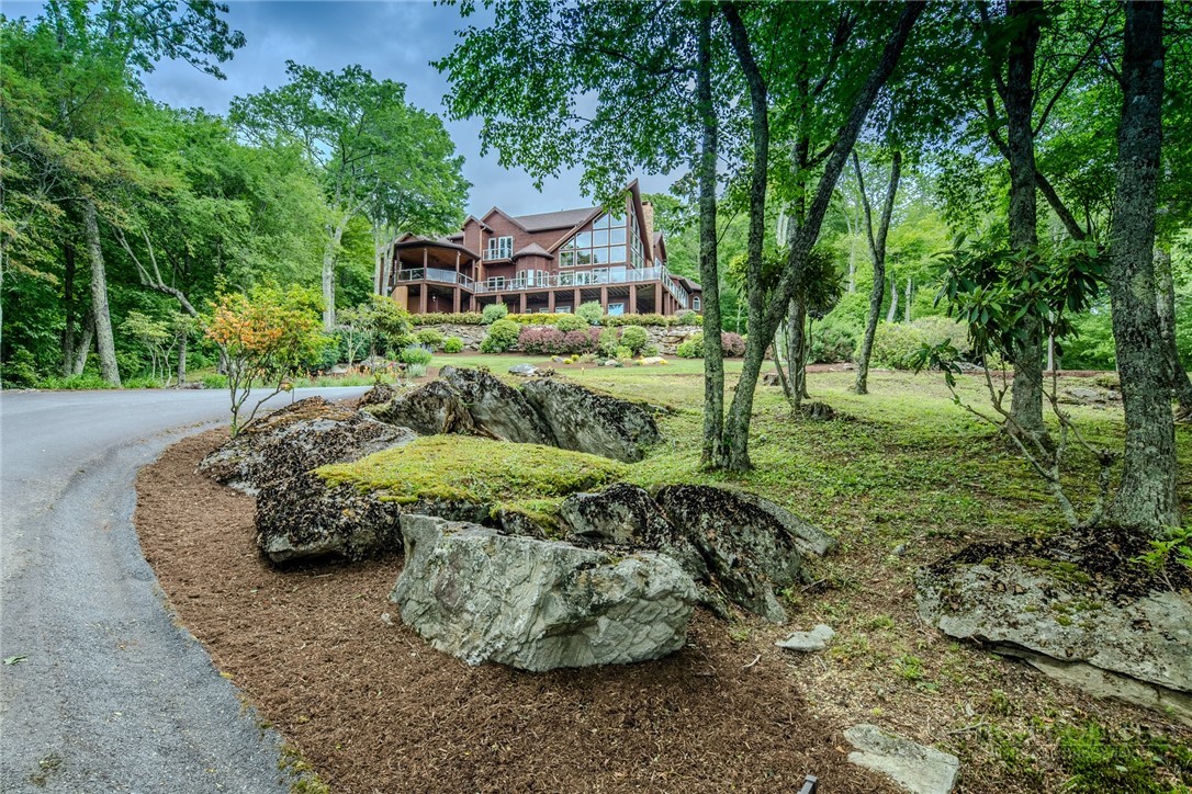 a wooden bench sitting in the middle of a forest